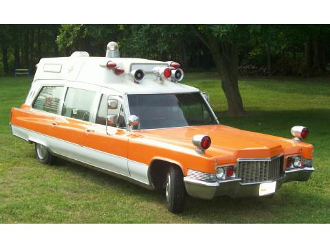 Orange over White 1970 Cadillac Model 9890 Ambulance with Black and Red 