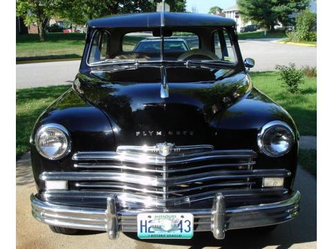 Black 1949 Plymouth Super Deluxe 2 Door Sedan with Wood and Tan interior 